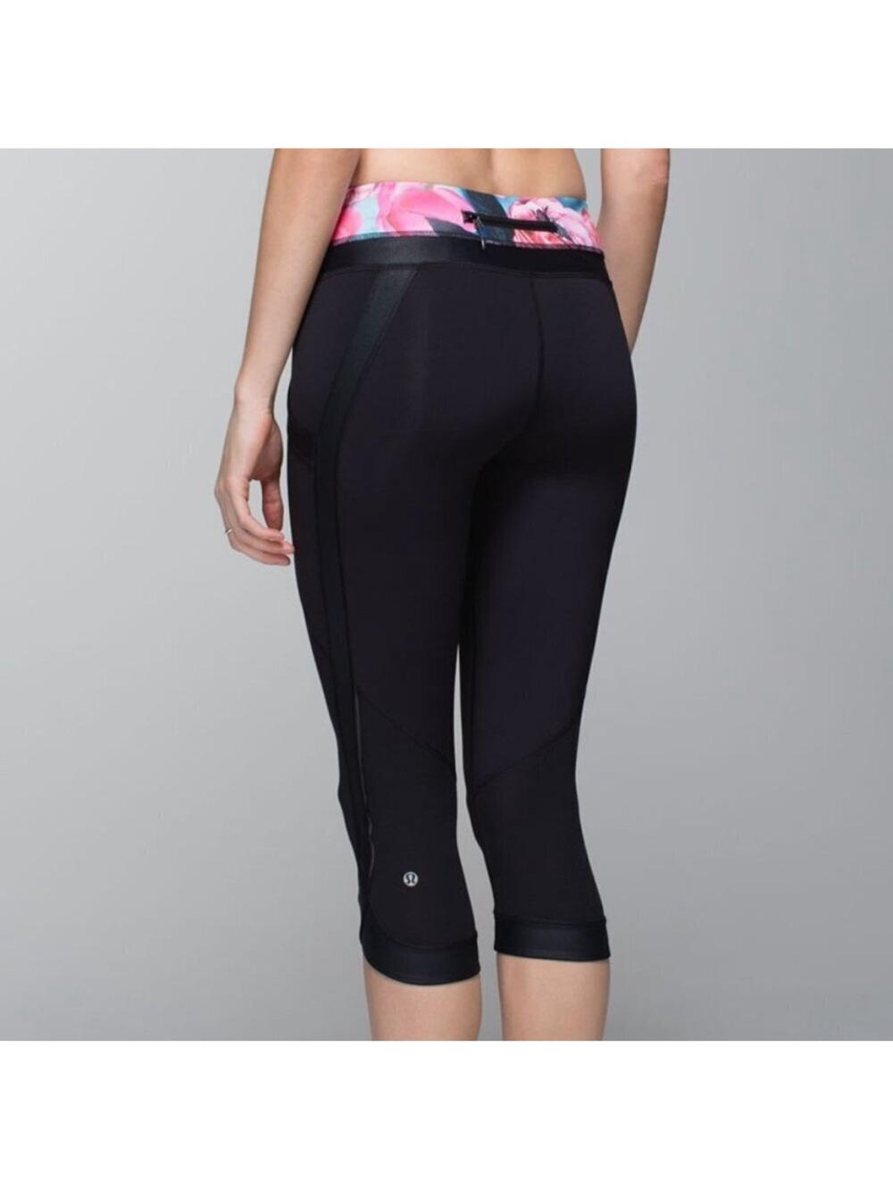 lululemon athletica Black Cropped Leggings with Pink Waistband.